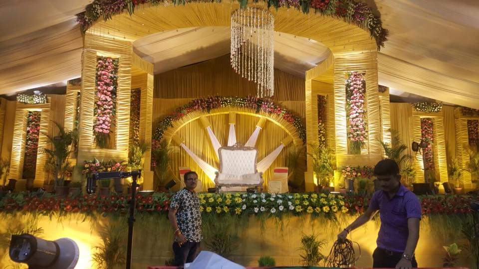 Covered shed with floral stage at Suman Venue Ujjain